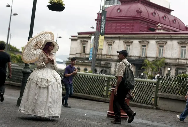Adriana Barahona, known as " Madame Barocle," wearing clothing of the Victorian era, walks along a central avenue in San Jose, Costa Rica June 4, 2015. Barahona says she has been passionate about clothing from the era of Britain's Queen Victoria (1837-1901), and has been making and wearing them since the age of 15. REUTERS/Juan Carlos Ulate