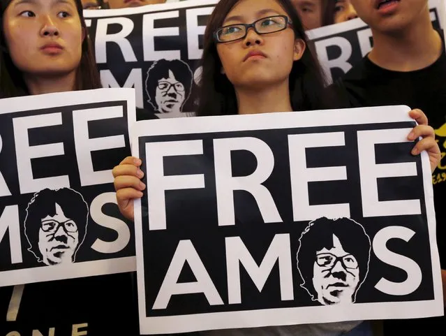 Students demanding the release of Singaporean teenager Amos Yee protest outside the Singapore Consulate in Hong Kong, China, June 30, 2015. Singapore court has ordered teenage blogger Amos Yee to undergo a mental health re-evaluation, after he was found guilty on charges of offending Christians and spreading an obscene image online. (Photo by Bobby Yip/Reuters)