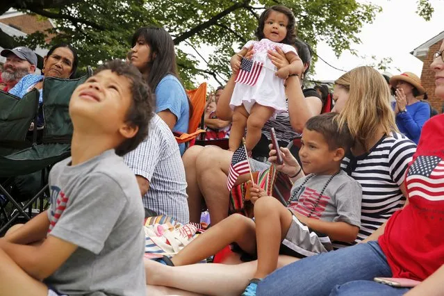 Spectators watch the Independence Day Parade in Fairfax, Virginia July 4, 2015. (Photo by Jonathan Ernst/Reuters)