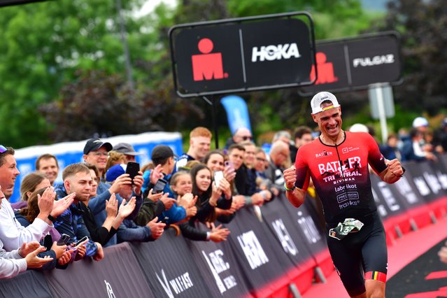 An athlete cheers after finishing the IRONMAN 70.3 Luxembourg on June 30, 2024 in Luxembourg, Luxembourg. (Photo by Alexander Koerner/Getty Images for Ironman)