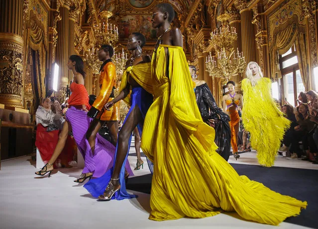 Models wear creations as part of the Balmain Ready To Wear Spring-Summer 2020 collection, unveiled during the fashion week, in Paris, Friday, September 27, 2019. (Photo by Thibault Camus/AP Photo)