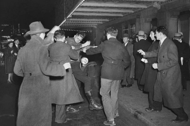 This February 20, 1939 file photo shows a crowd of demonstrators outside New York's Madison Square Garden as they seize a uniformed member of the German American Bund who had emerged from a Bund rally and attempted to enter a taxi. he pro-Hitler rally that took place 80 years ago this week at New York’s Madison Square Garden is the subject of a short documentary that’s up for an Oscar this Sunday, Feb. 24, 2019. The film directed by Marshall Curry is called a “A Night at the Garden”. (Photo by AP Photo/File)