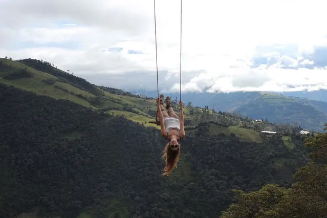 These are the stomach-churning pictures of the swing at the end of the world – a rickety wooden swing hanging over a precipice 2,660 metres above sea level – and not a seatbelt in sight. (Photo by Caters News)