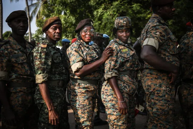 Military and security forces queue to vote in advance outside a ballot station at Bissau, Guinea-Bissau, 21 November 2019. Presidential elections will be held in Guinea-Bissau on 24 November 2019 with a round between 12 candidates from a range of parties with a second round planned for 29 December if no candidate receives more than 50 percent of the vote. (Photo by Andre Kosters/EPA/EFE)