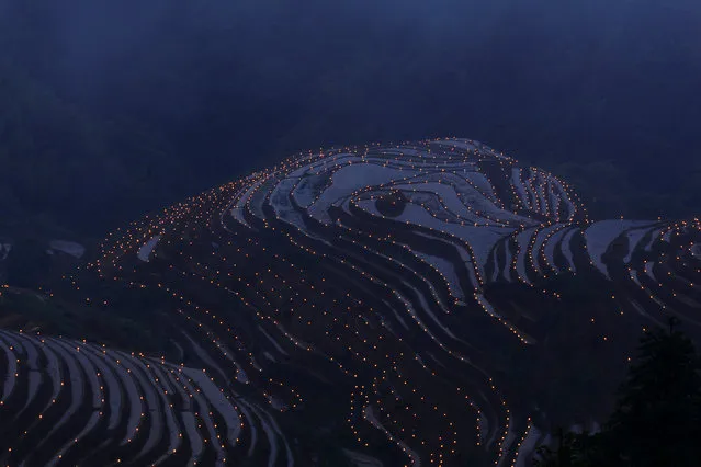 Thousands of torches are placed in terraced fields by villagers during a local festival praying for good harvest at Guilin, Guangxi Zhuang Autonomous Region, China June 3, 2017. (Photo by Reuters/Stringer)