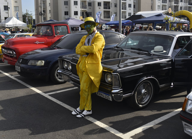 People visit vintage cars exhibition in Jacarepagua city, in the West Zone of Rio de Janeiro, Brazil on June 25, 2023. (Photo by Fabio Teixeira/Anadolu Agency via Getty Images)