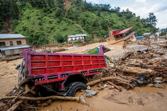 A general view shows the area affected by monsoon flooding in Roshi village of Nepal's Kavre district on September 30, 2024. Search and rescue teams in Nepal's capital picked through wrecked homes on September 30 after waters receded from monsoon floods that killed at least 209 people around the Himalayan republic. (Photo by Prabin Ranabhat/AFP Photo)