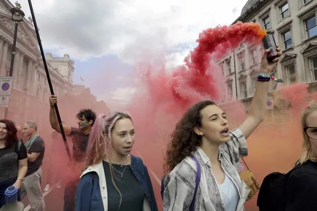 A womand holds a flare during a 'March for Europe' demonstration against Britain's decision to leave the European Union, in Parliament Square, central London, Britain July 2, 2016. (Photo by Paul Hackett/Reuters)