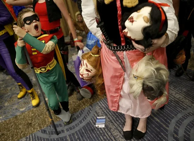 William Camp dressed up as “Robin” yawns while waiting in line for the start of the costume contest at Wizard World Comic Con in Chicago, Illinois, United States, August 22, 2015. (Photo by Jim Young/Reuters)