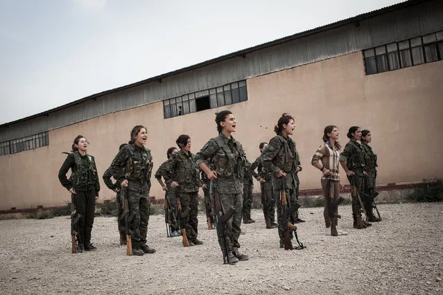Young YPJ recruits participate in drills at dawn near Derek City, Syria. The YPJ schedule is demanding and requires discipline – new soldiers in training get about 6 hours of sleep a night and wake up at 4 AM; their day consists of a full schedule of drills and classroom lessons. Before joining the YPJ many of the girls had never participated in physical activity or sports before. (Photo by Erin Trieb/NBC News)