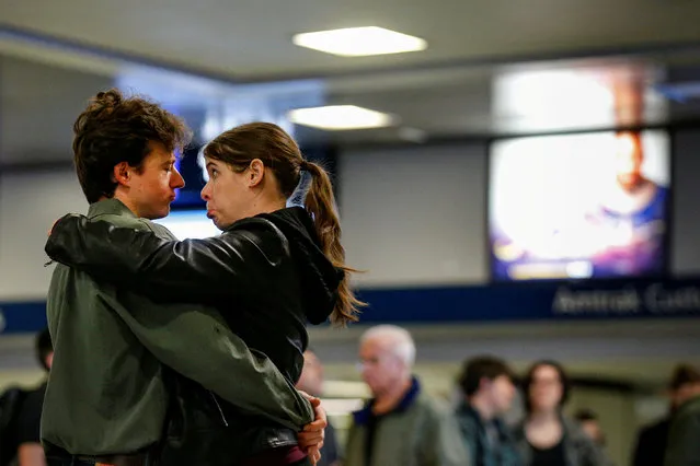A couple say goodbye while waiting for Amtrak trains to be called, ahead of the Thanksgiving Day holiday, at Pennsylvania Station in New York City, U.S., November 22, 2017. (Photo by Brendan McDermid/Reuters)