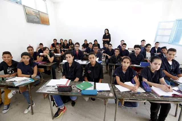 Teacher Manel el Ayachi poses for a picture on the first day of a new school year at Linine Street  Preparatory School in Tunis, Tunisia, September 16, 2015. Schools have reopened, with around 2 million pupils heading back to classrooms after a three-month summer break. (Photo by Anis Mili/Reuters)