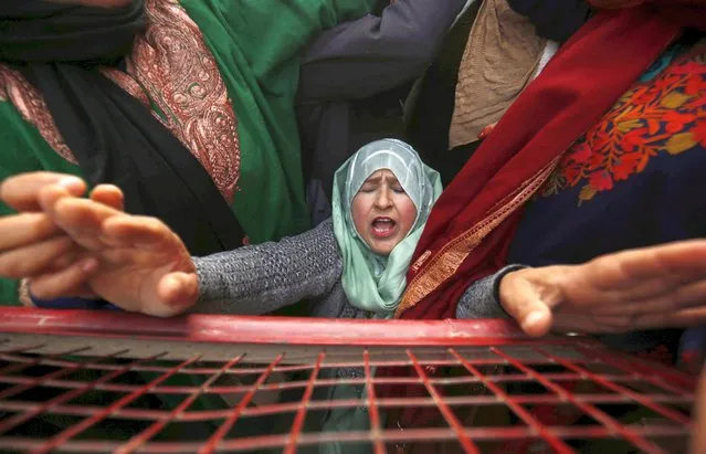 A female worker of the social welfare department, working under the Anganwadi scheme, shouts slogans during a protest in Srinagar, the summer capital of Indian Kashmir, 20 December 2022. Dozens of Anganwadi workers and helpers protested against the newly approved human resource (HR) policy framed by the government. (Photo by Farooq Khan/EPA/EFE)