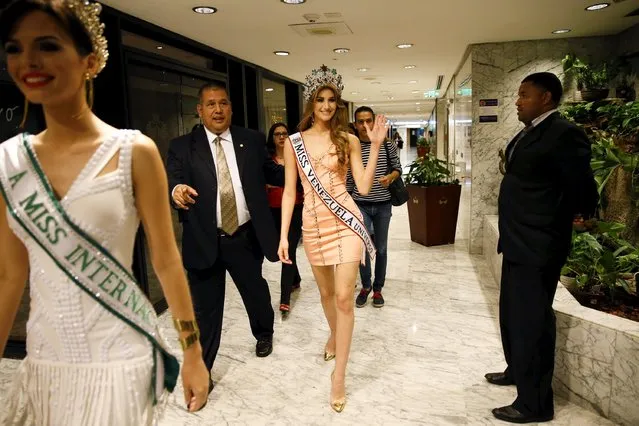 Miss Venezuela 2015 Mariam Habach (C) waves while she arrives at a news conference in Caracas October 9, 2015. Habach won the Miss Venezuela pageant and will represent the country in the Miss Universe pageant. (Photo by Carlos Garcia Rawlins/Reuters)