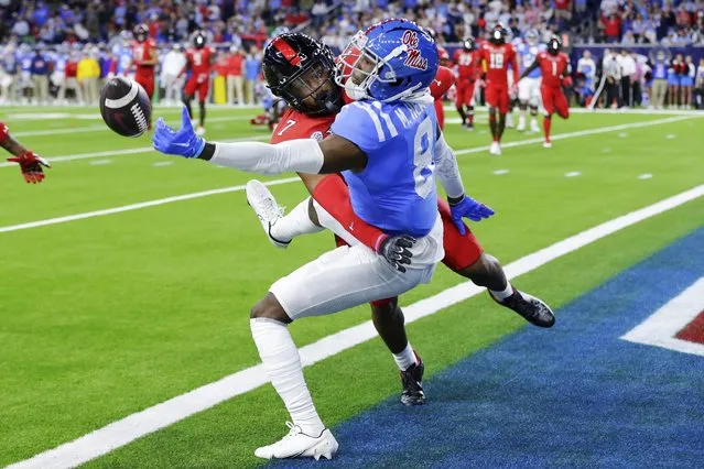 Mississippi wide receiver Malik Heath (8) can't make the end zone reception under pressure from Texas Tech defensive back Adrian Frye (7) during the second half of the Texas Bowl NCAA college football game Wednesday December 28, 2022, in Houston. (Photo by Michael Wyke/AP Photo)
