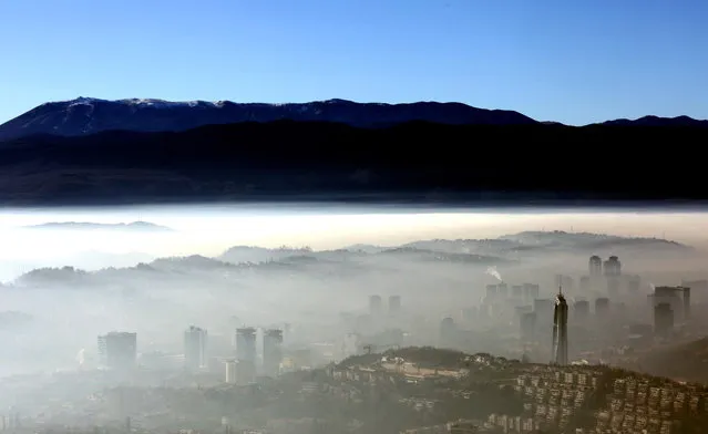 A general view of the surroundings of the city of Sarajevo, Bosnia and Herzegovina, 01 January 2023. With an AQI (Air Quality Index) of 174, which is labeled as 'unhealthy', the Bosinan capital is among the most polluted cities in the world, ranking in 5th place on 01 January 2023. (Photo by Fehim Demir/EPA/EFE)