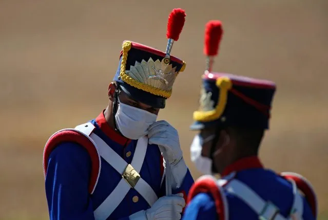 Honor guards gather before a national flag hoisting ceremony during the celebration of the country's Independence Day in Brasilia, Brazil, September 7, 2020. (Photo by Adriano Machado/Reuters)