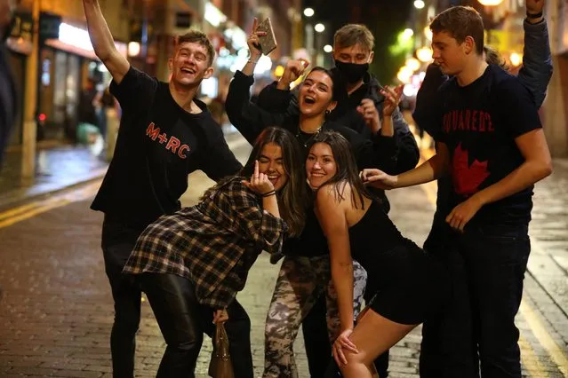 People out socialising in Liverpool city centre on October 10, 2020, ahead of the 10pm curfew that pubs and restaurants are subject to in order to combat the rise in coronavirus cases in England. Cities in northern England and other areas suffering a surge in Covid-19 cases may have pubs and restaurants temporarily closed to combat the spread of the virus. (Photo by Peter Byrne/PA Images via Getty Images)