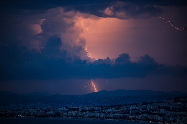 This photograph shows lightning striking over the French Riviera city of Nice, Southerneast France, on August 14, 2024. (Photo by Valery Hache/AFP Photo)