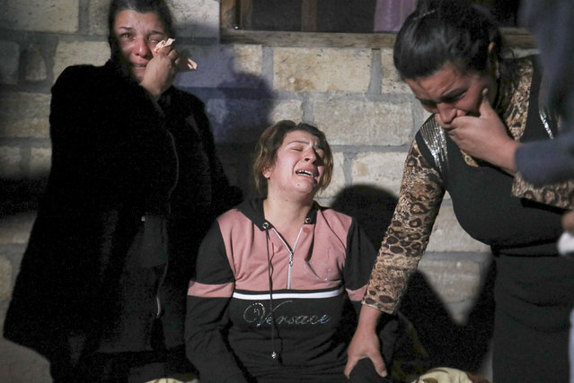 Azerbaijan's women mourn a man killed during shelling by Armenian forces in Qarayusifli village in Barda region, Azerbaijan, Tuesday, October 27, 2020. (Photo by AP Photo/Stringer)