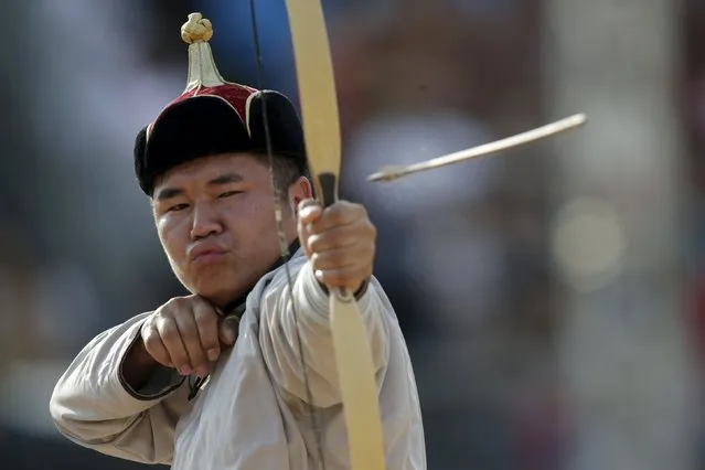 An indigenous man from Mongolia fires an arrow during the bow-and-arrow competition at the first World Games for Indigenous Peoples in Palmas, Brazil, October 28, 2015. (Photo by Ueslei Marcelino/Reuters)