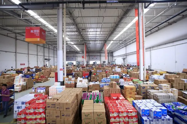 Employees work at a Tmall logistic centre in Suzhou, Jiangsu province, China, October 28, 2015. (Photo by Jason Lee/Reuters)
