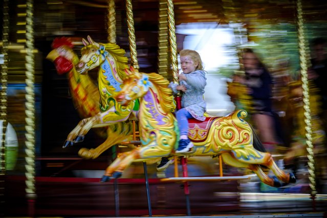 Families ride a traditional carousel at the Henham Steam and Country Show, in Suffolkб UK on September 21, 2025. (Photo by Jason Bye/The Times)