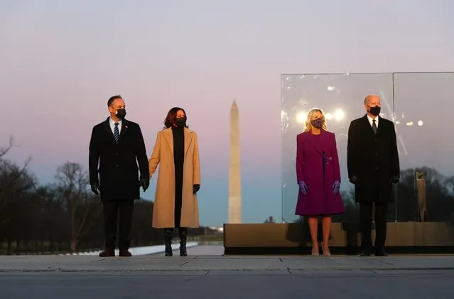 President-elect Joe Biden, his wife Jill Biden, Vice President-elect Kamala Harris and her husband Doug Emhoff attend a coronavirus memorial event at the Lincoln Memorial in Washington, January 19, 2021. Biden led a national memorial observance on the eve of his inauguration to honor the 400,000 Americans who have perished from COVID-19 during the 11 months since the coronavirus claimed its first U.S. life. (Photo by Tom Brenner/Reuters)