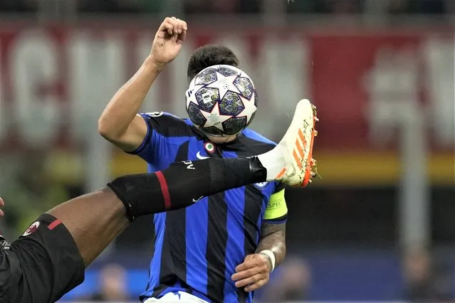 Inter Milan's Lautaro Martinez fights for the ball with AC Milan's Fikayo Tomori, left, during the Champions League semifinal first leg soccer match between AC Milan and Inter Milan at the San Siro stadium in Milan, Italy, Wednesday, May 10, 2023. (Photo by Antonio Calanni/AP Photo)