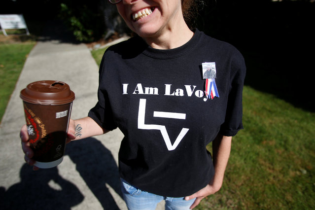 A supporter of the Josephine County Oath Keepers, which later disbanded and became the Liberty Watch of Josephine County, wears a shirt with the brand used by LaVoy Finicum, who was killed during the Malheur National Wildlife Refuge occupation, before a Memorial Day parade in Grants Pass, Oregon, U.S. May 28, 2016. In April 2015 Reuters photographer Jim Urquhart was assigned to cover the Oath Keepers during a tour of the Sugar Pine gold mine in Oregon after the group of former cops, military, firefighters and other first responders had risen to prominence during a standoff in Nevada over land rights. “Some call them militia. They call themselves patriots. In the United States, many local militias are armed and have taken issue with some government policies. After spending a year with groups in Oregon, Montana, Nevada and Idaho protesting what they describe as government overreach, I've decided not to label them at all”. (Photo by Jim Urquhart/Reuters)