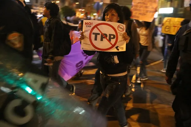 People take part in a protest against the Trans-Pacific Partnership (TPP) in Lima, Peru, November 4, 2016. (Photo by Guadalupe Pardo/Reuters)