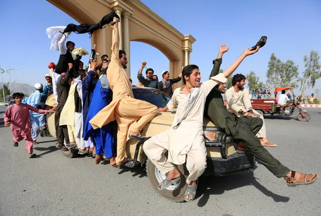 People celebrate ceasefire in Rodat district of Nangarhar province, Afghanistan June 16, 2018. (Photo by Reuters/Parwiz)