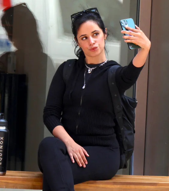 American singer-songwriter Camilla Cabello walking by herself on Broadway then waiting for a car service and taking selfies on the street in Soho, New York, NY on May 30, 2023. (Photo by Dylan Travis/Splash News and Pictures)