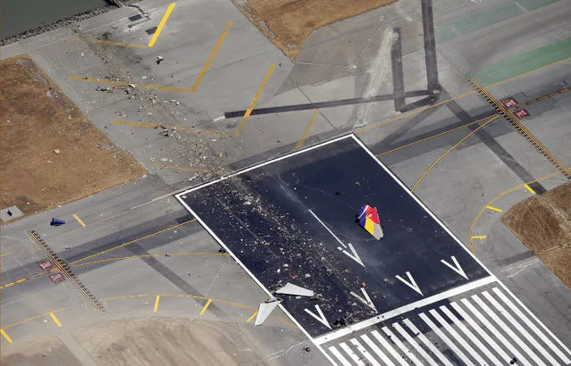 A close up of the runway and debris of a Boeing 777 airplane that burned on the runway after it crash landed at San Francisco International Airport July 6, 2013 in San Francisco, California. An Asiana Airlines passenger aircraft coming from Seoul, South Korea crashed while landing. There has been at least two casualties reported. (Photo by Ezra Shaw/Getty Images)