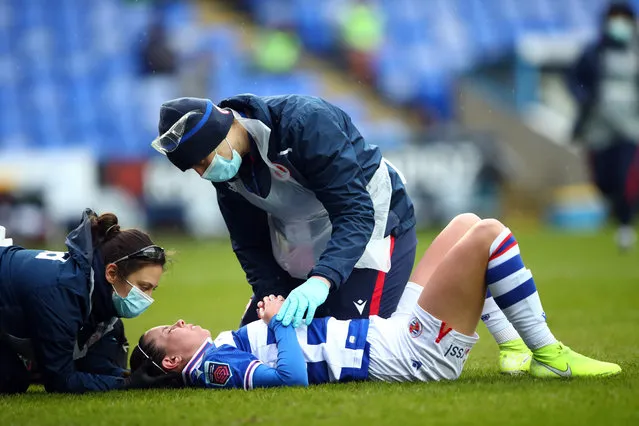 Deanna Cooper of Reading Women is treated for injury during the Barclays FA Women's Super League match between Reading Women and Everton Women at Madejski Stadium on February 14, 2021 in Reading, England. Sporting stadiums around the UK remain under strict restrictions due to the Coronavirus Pandemic as Government social distancing laws prohibit fans inside venues resulting in games being played behind closed doors. (Photo by Marc Atkins/Getty Images)