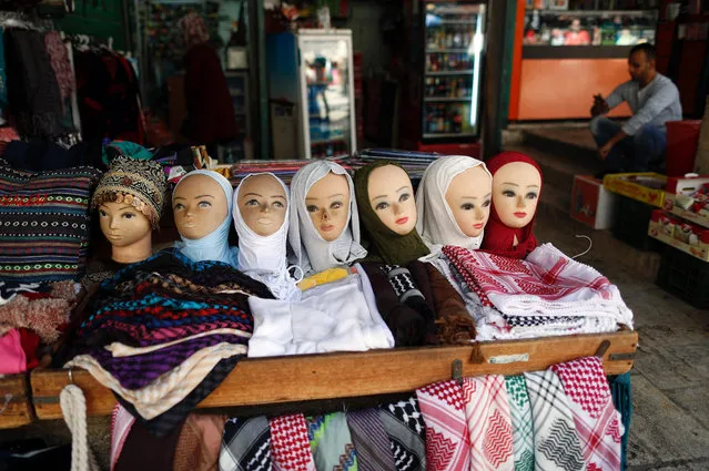 A picture taken on November 14, 2016 shows heads of mannequins wearing Muslim scarves in a shop in the Arab quarter of Jerusalem' s Old City. (Photo by Thomas Coex/AFP Photo)