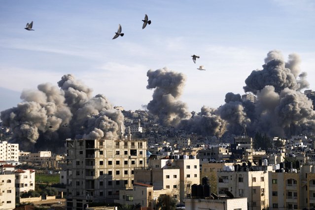 Smoke rises following an explosion detonated by the Israeli army, which said it was destroying buildings used by Palestinian militants in the West Bank Jenin refugee camp, Sunday, February 2, 2025. (Photo by Majdi Mohammed/AP Photo)