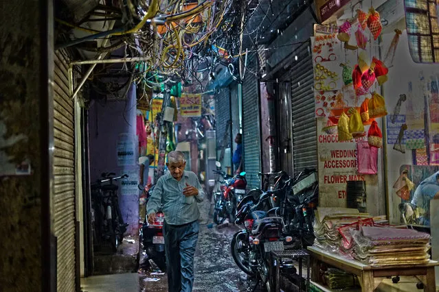 “This was taken in Old Delhi, India, just as rain hit for the first time in a few weeks”. (Photo by Jake Davies/The Guardian)