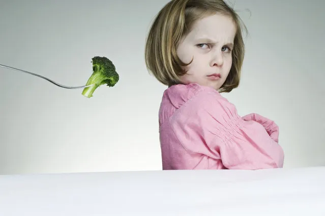 Five year old girl who is not keen on eating her greens. (Photo by Richard Clark/Getty Images)