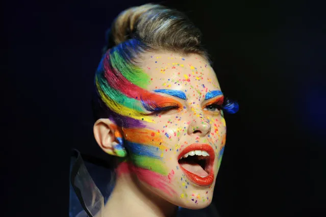In this Jan. 18, 2016 photo a model presents a make-up creation by Maybelline during the Mercedes-Benz Fashion Week in Berlin, Germany. The Fall/Winter 2016/2017 collections are presented during the Berlin Fashion Week from Jan. 18 to 22. (Photo by Britta Pedersen/DPA via AP Photo)