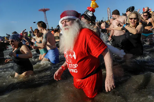 A man dressed as Santa Claus participates in the annual Polar Bear Plunge in Coney Island in the Brooklyn Borough of New York City, U.S. January 1, 2017. (Photo by Stephanie Keith/Reuters)