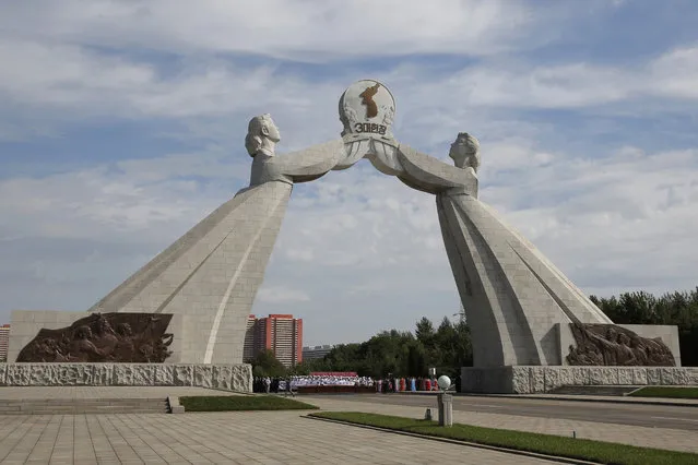 This Tuesday, September 11, 2018, photo shows the Arch of Reunification, a monument to symbolize the hope for eventual reunification of the two Koreas, in Pyongyang, North Korea. While Pyongyang's talks with Washington over the future of Kim Jong Un's nuclear arsenal have bogged down, South Korean President Moon Jae-in is pushing hard to link the roads and railways of the two Koreas and to help improve the North's often decrepit infrastructure. (Photo by Kin Cheung/AP Photo)