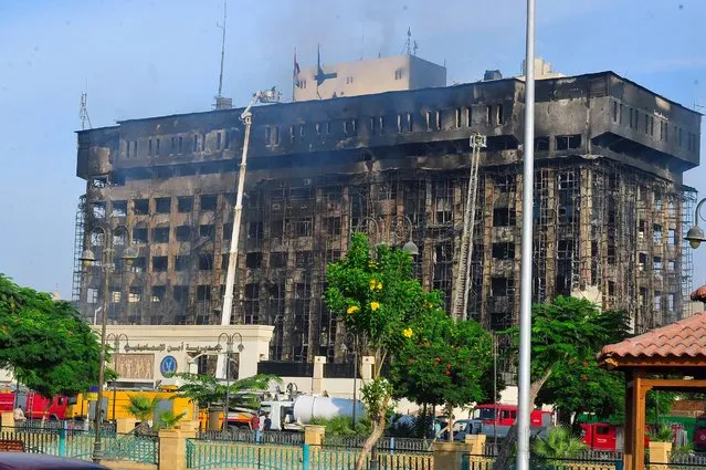 Firefighters try to extinguish a fire at the Security Directorate building in Ismailia, Egypt, 02 October 2023. According to the Egyptian Ministry of Health and Populations, at least 26 people were injured in the fire that started on the morning of 02 October. (Photo by EPA/EFE/Stringer)