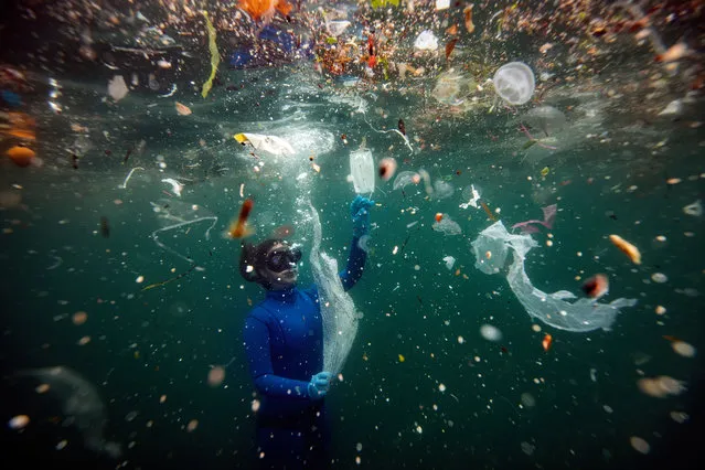 Turkish world record-holder free-diver and divers of the Underwater Federation Sahika Encumen dives amid plastic waste in Ortakoy coastline to observe the life and pollution of Bosphorus in Istanbul, Turkey on June 27, 2020. Sahika Encumen, announced as “Life Below Water Advocate” by United Nations Development Program (UNDP) Turkey, this time dives in to raise awareness on plastic pollution. (Photo by Sebnem Coskun/Anadolu Agency via Getty Images)
