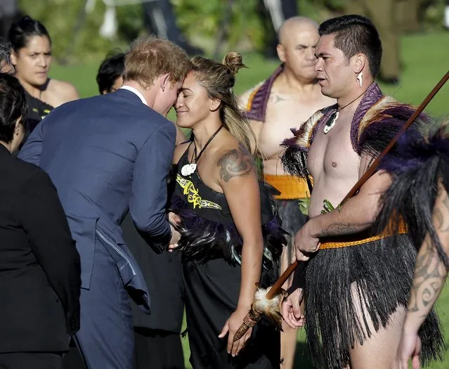 Britain's Prince Harry receives a hongi (traditional Maori greeting) from a Maori woman during his official welcome at the Government House in Wellington, May 9, 2015. Harry is starting a week-long tour of New Zealand. (Photo by Anthony Phelps/Reuters)