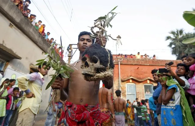 Hindu devotees carry human skulls during the annual Shiva Gajan religious festival at Kurmun village, in West Bengal, India, April 12, 2016. (Photo by Rupak De Chowdhuri/Reuters)