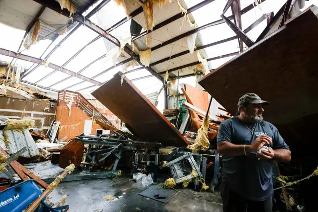 Lynn Champagne of E.C.O. Builders surveys the damage after the building was struck by an apparent tornado in south Slidell, La., Wednesday, April 10, 2024. (Photo by Scott Threlkeld/The Times-Picayune/The New Orleans Advocate via AP Photo)