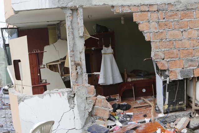 A destroyed home is seen in Pedernales, Ecuador, Sunday, April 17, 2016. The strongest earthquake to hit Ecuador in decades flattened buildings and buckled highways along its Pacific coast, sending the Andean nation into a state of emergency. (Photo by Dolores Ochoa/AP Photo)