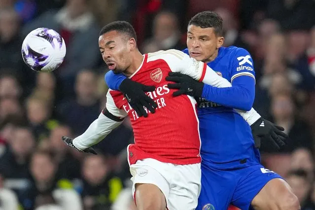 Arsenal's Gabriel Jesus, left, duels for the ball with Chelsea's Thiago Silva during the English Premier League soccer match between Arsenal and Chelsea at Emirates Stadium in London, Tuesday, April 23, 2024. (Photo by Kin Cheung/AP Photo)