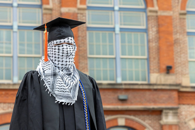 A Palestinian student, who plans to return to his homeland after graduation and who wishes to remain anonymous, poses for a portrait while wearing a keffiyeh along with his commencement cap, amid the ongoing conflict between Israel and the Palestinian Islamist group Hamas, at the Auraria Campus in Denver, Colorado, U.S., May 10, 2024. (Photo by Kevin Mohatt/Reuters)